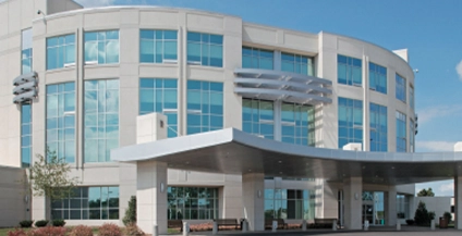 white curved building with light blue windows