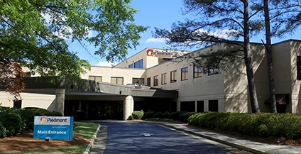 white building surrounded by trees