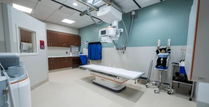 inside empty patient room with medical equipment